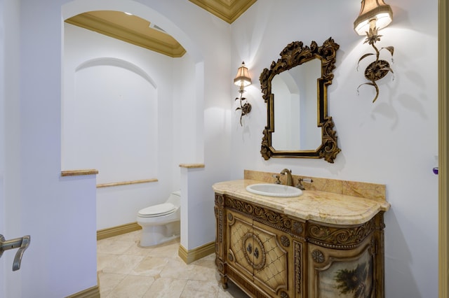 135 Playa Rienta Way, Palm Beach Gardens, FL 33418 - bathroom with toilet, vanity, crown molding, baseboards, and tile patterned floors