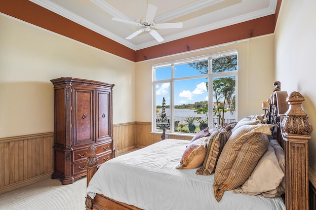 bedroom featuring light colored carpet, ceiling fan, and crown molding