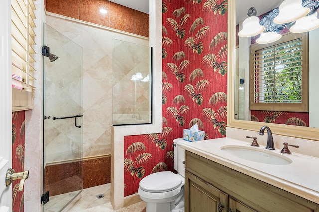 bathroom with walk in shower, vanity, and toilet