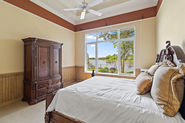 135 Playa Rienta Way, Palm Beach Gardens, FL 33418 - bedroom featuring a wainscoted wall, a water view, ornamental molding, light colored carpet, and wood walls