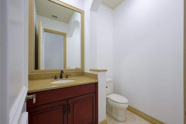 bathroom featuring ornamental molding, tile patterned flooring, vanity, and toilet