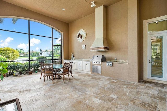 135 Playa Rienta Way, Palm Beach Gardens, FL 33418 - view of patio / terrace with exterior kitchen, area for grilling, and outdoor dining space