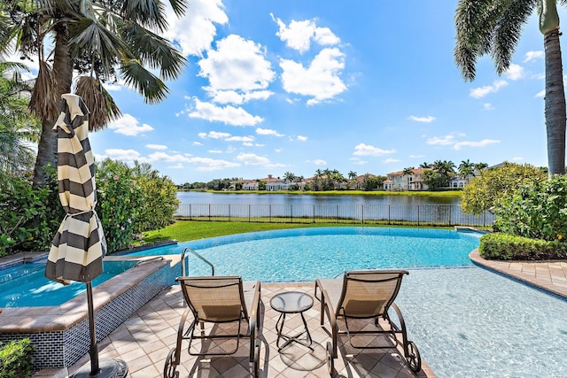 135 Playa Rienta Way, Palm Beach Gardens, FL 33418 - view of pool featuring a fenced backyard, a water view, and a patio