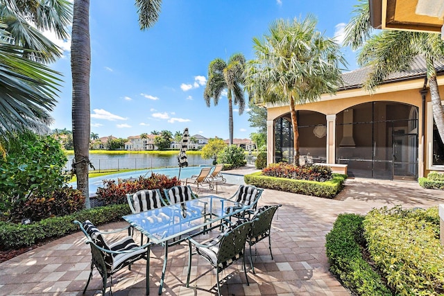 135 Playa Rienta Way, Palm Beach Gardens, FL 33418 - view of patio / terrace with a water view and outdoor dining space