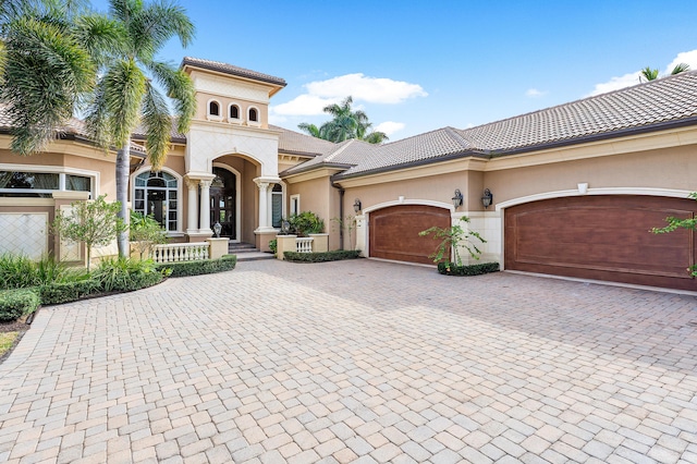 mediterranean / spanish-style house featuring a garage