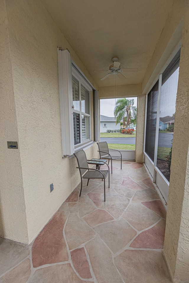 view of patio featuring ceiling fan