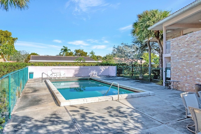 view of pool featuring a patio area