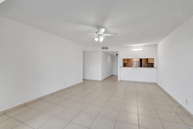 unfurnished living room with ceiling fan and light tile patterned flooring