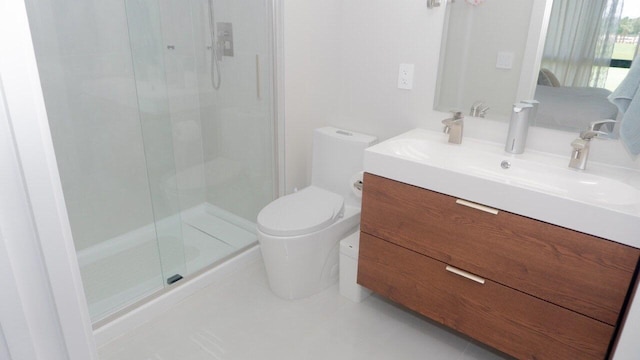 bathroom featuring toilet, tile patterned floors, an enclosed shower, and vanity