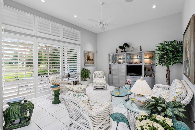 tiled living room with ceiling fan