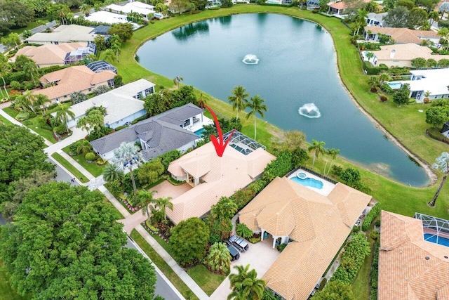 birds eye view of property with a water view