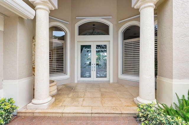 property entrance featuring french doors and a patio