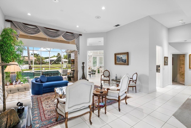 living room with light tile patterned floors and a wealth of natural light