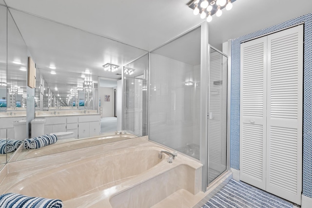 bathroom featuring vanity and plus walk in shower