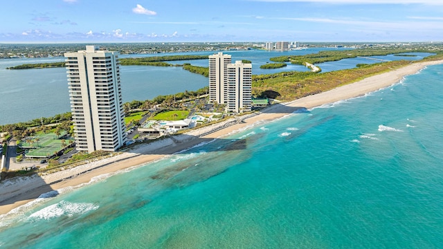 birds eye view of property featuring a water view and a view of the beach