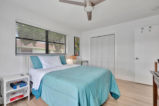 bedroom featuring a closet, ceiling fan, and light hardwood / wood-style floors