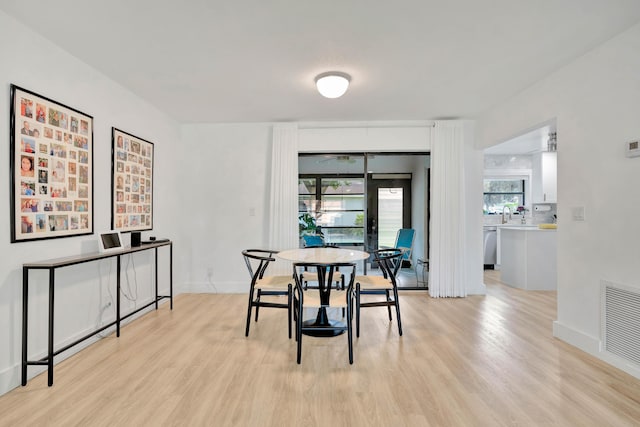 dining room with light wood-type flooring