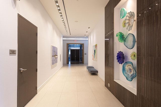 hallway featuring light tile patterned floors