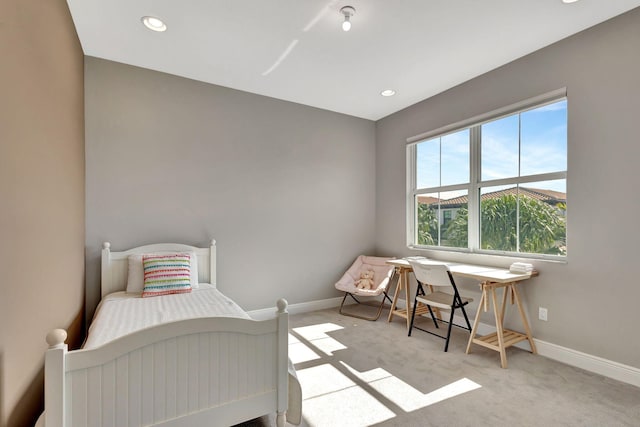 bedroom with light carpet