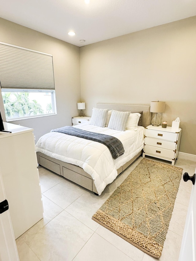 bedroom featuring light tile patterned floors