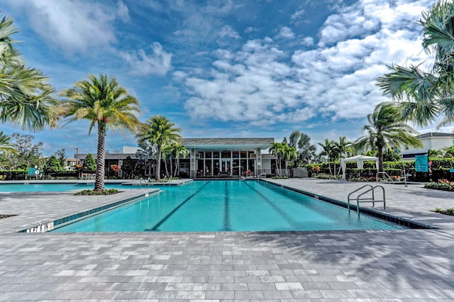 view of swimming pool with a patio