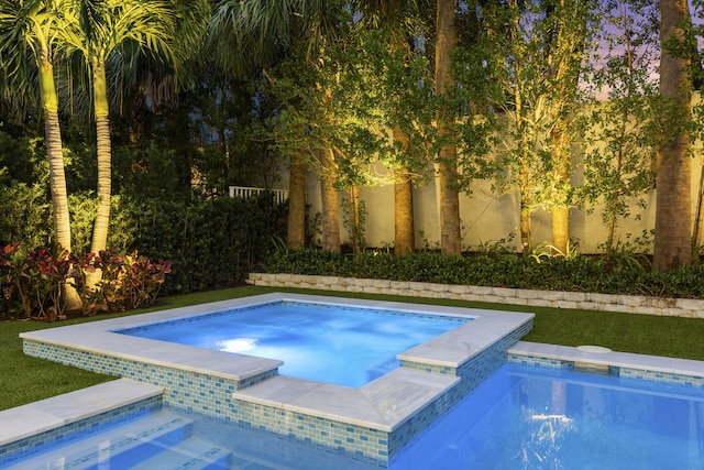 view of swimming pool featuring an in ground hot tub