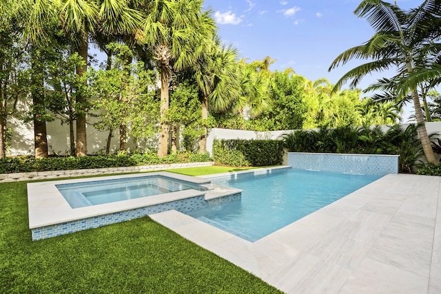 view of swimming pool with a yard