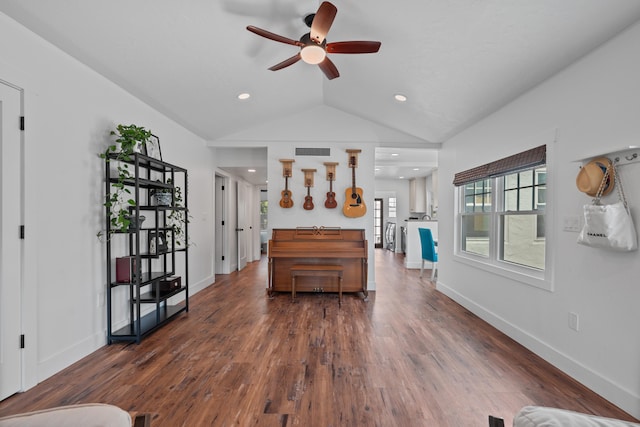 interior space with lofted ceiling, ceiling fan, and dark hardwood / wood-style flooring