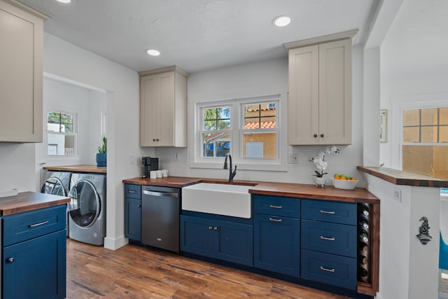 kitchen featuring sink, dark wood-type flooring, dishwasher, and butcher block countertops