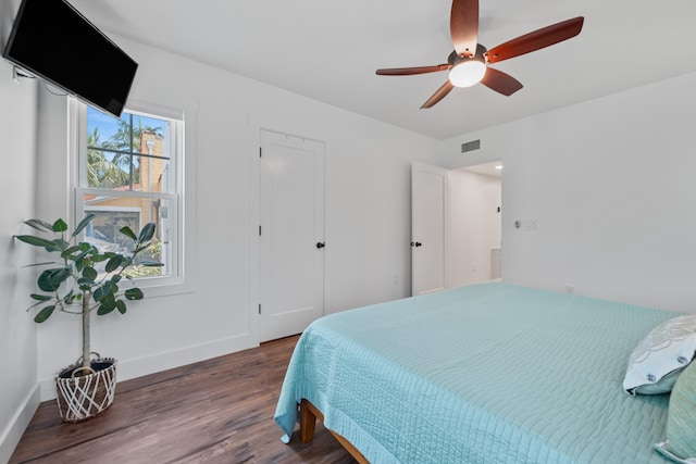 bedroom featuring ceiling fan and dark hardwood / wood-style flooring