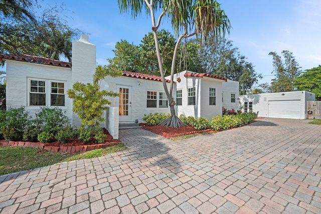 mediterranean / spanish house with a garage