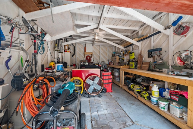 garage with ceiling fan and a workshop area