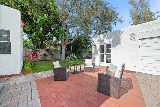 view of patio featuring french doors and an outdoor living space