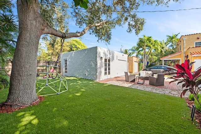 view of yard with an outdoor hangout area, a patio area, and a storage shed