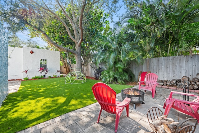 view of patio / terrace with an outdoor fire pit