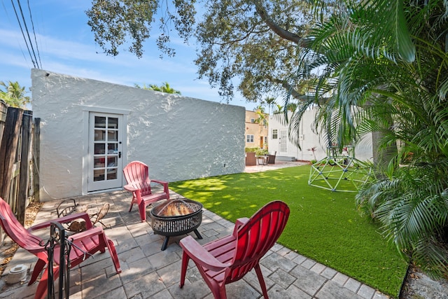 view of patio / terrace featuring an outdoor fire pit