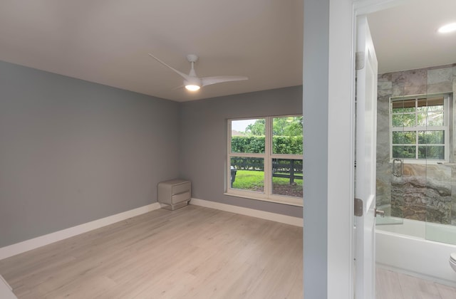 spare room with ceiling fan and light hardwood / wood-style floors