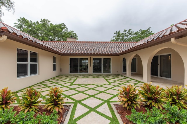 back of property featuring a patio area