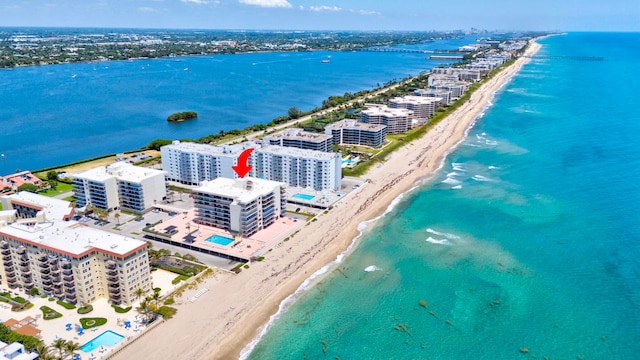 aerial view with a view of the beach and a water view