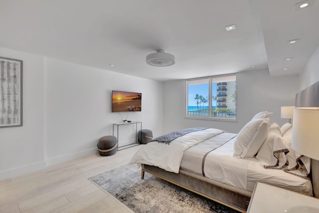 bedroom with light hardwood / wood-style flooring