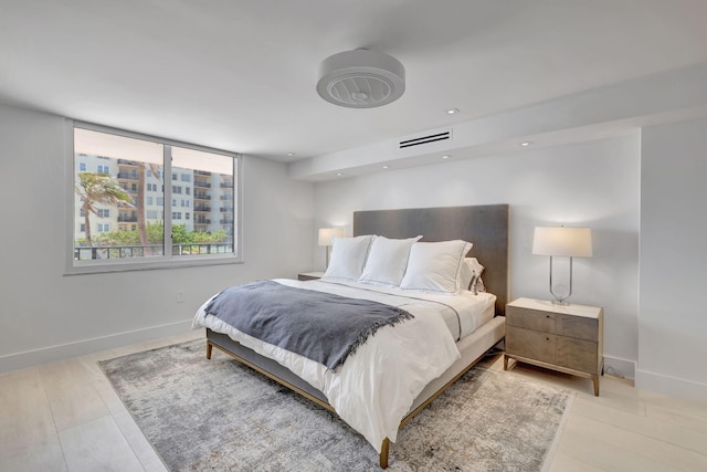 bedroom with light wood-type flooring