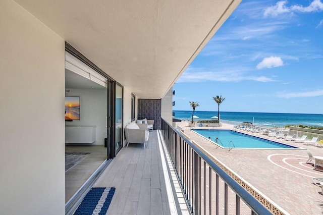 balcony featuring a water view