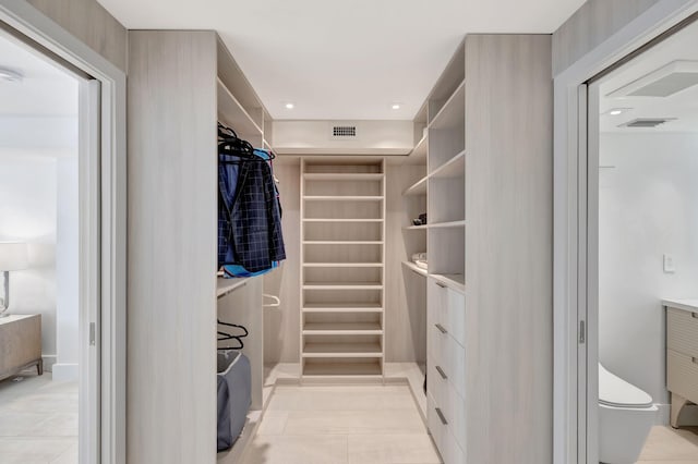 walk in closet featuring light tile patterned floors