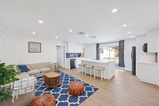 living room with light hardwood / wood-style floors