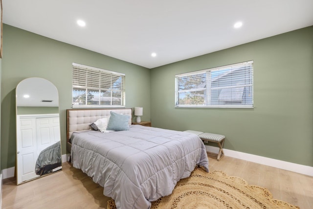 bedroom with light hardwood / wood-style floors