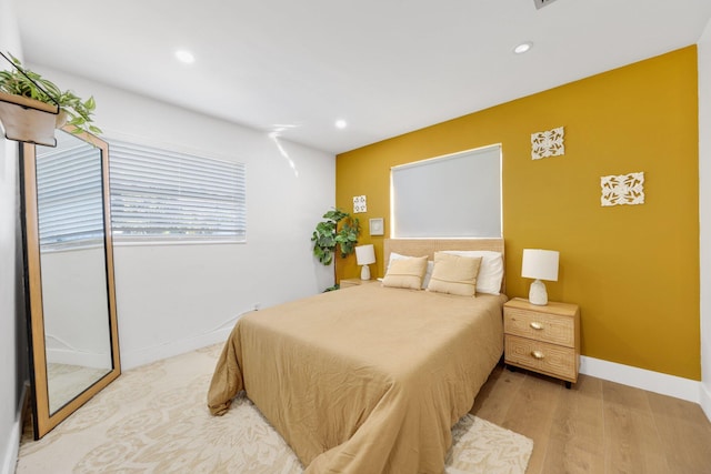 bedroom with light hardwood / wood-style flooring