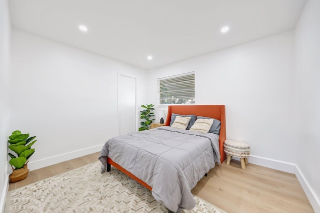 bedroom with hardwood / wood-style floors