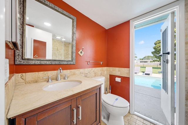 bathroom with tile patterned floors, vanity, and toilet