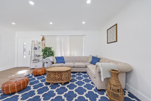 living room featuring hardwood / wood-style floors and ornamental molding