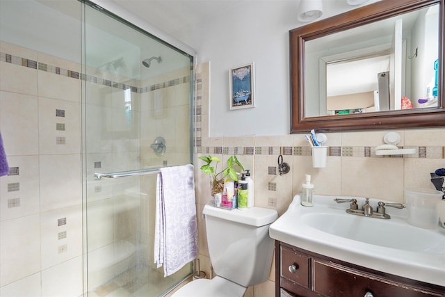 714 NE 10th St Unit 205, Hallandale Beach, FL 33009 - full bathroom with a shower stall, vanity, toilet, and tile walls